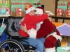 stepping-stones-camp-allyn-holiday-party-santa-hug-batavia-ohio