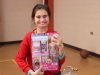 Child at Saturday Kids Club, part of Stepping Stones Ohio smiles with new gift