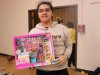 Child at Saturday Kids Club, part of Stepping Stones Ohio shows off her new Barbie.