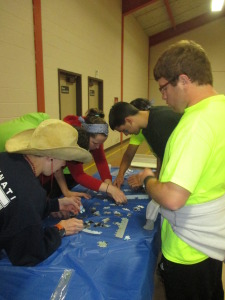 Blue team working relentlessly on their tricky puzzle!