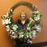 Sharon Hobbs holds wreath made by Norwood Community Senior Center participants
