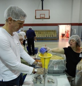 Stepping Stones and Rotary Club of Cincinnati package 20,000 meals for Stop Hunger Now