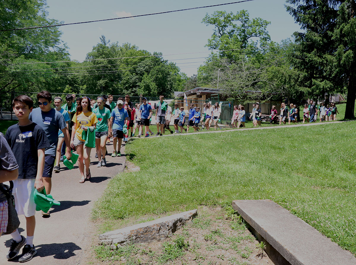 Student volunteers arrive for summer volunteer orientation at Stepping Stones.